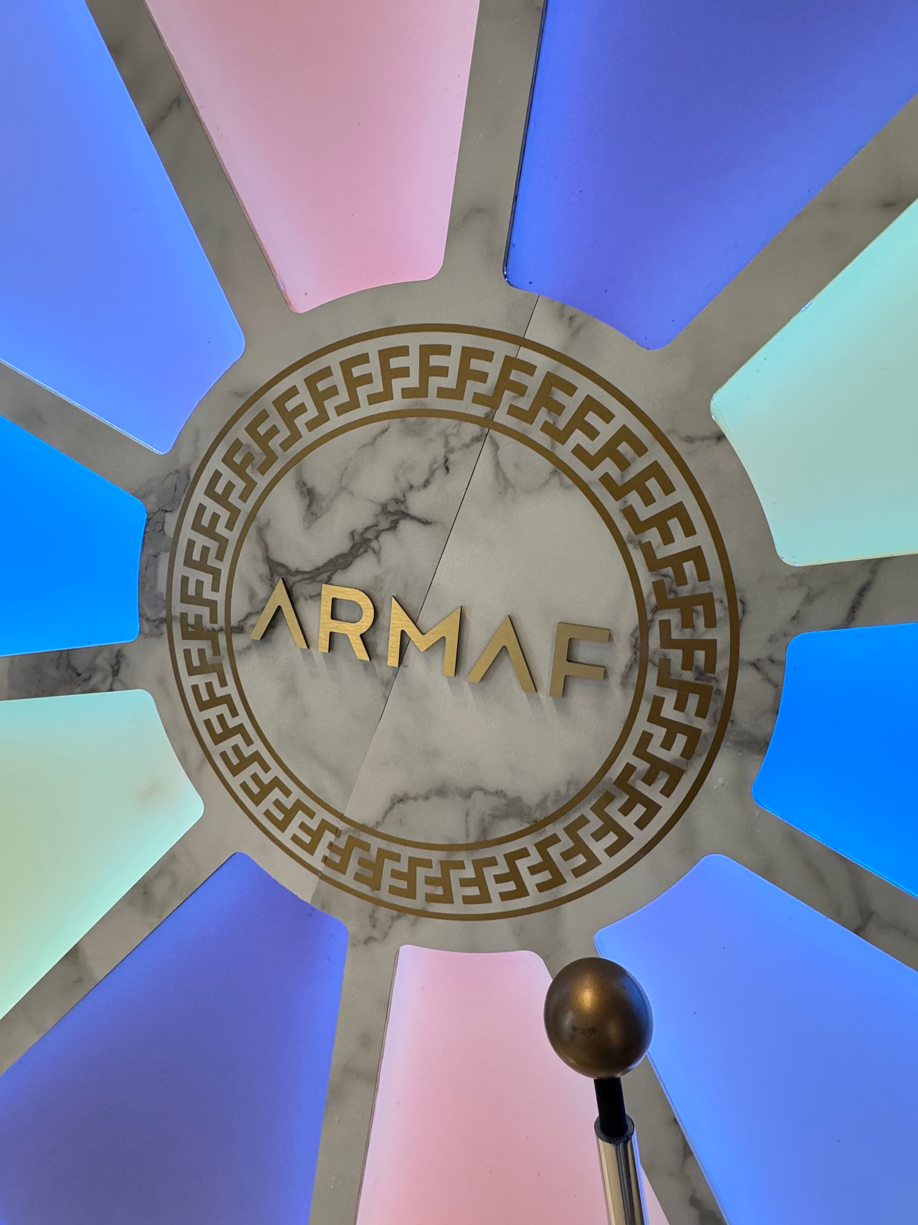 Decorative ceiling with geometric design and 'Armaf' logo